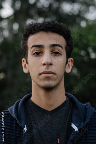 Young Male Modeling in Black and White Jacket