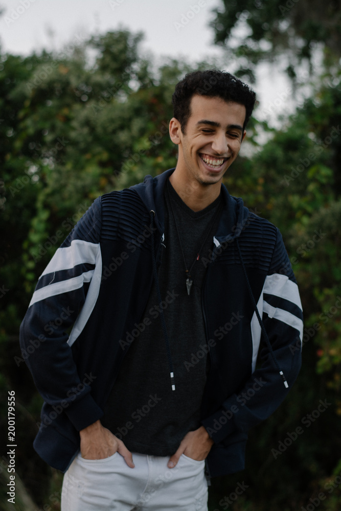 Young Male Modeling in Black and White Jacket