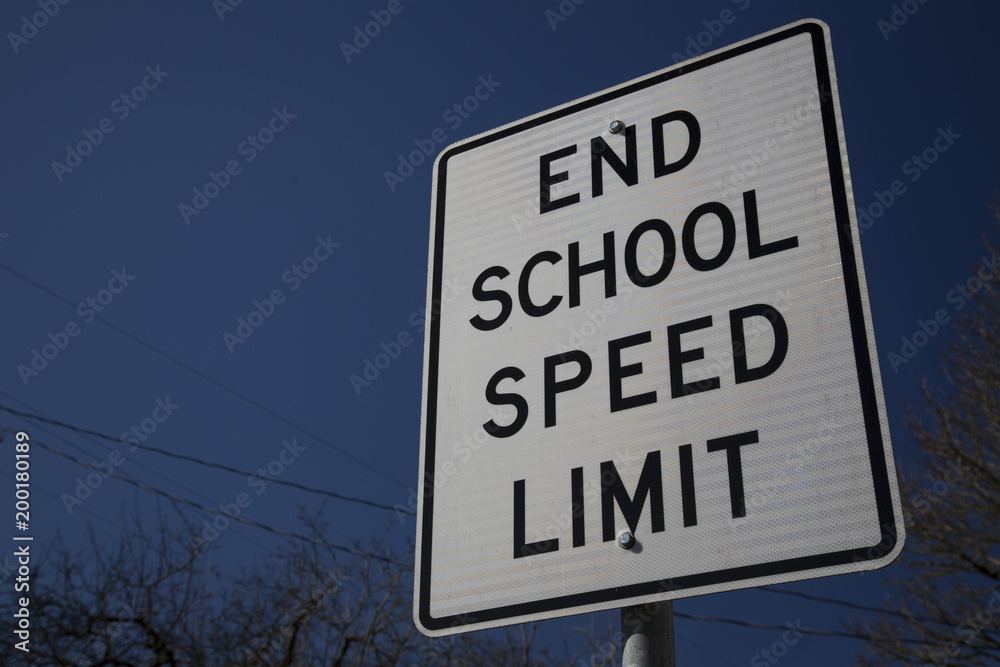 End School Speed sign against blue sky background