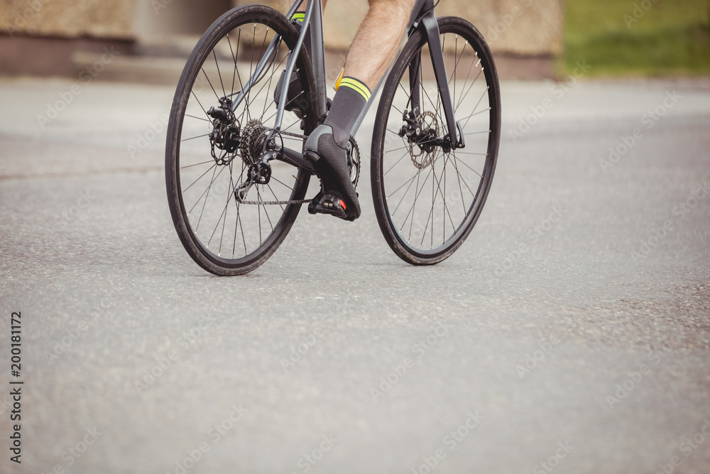 Athlete riding his bicycle Athlete riding his bicycle