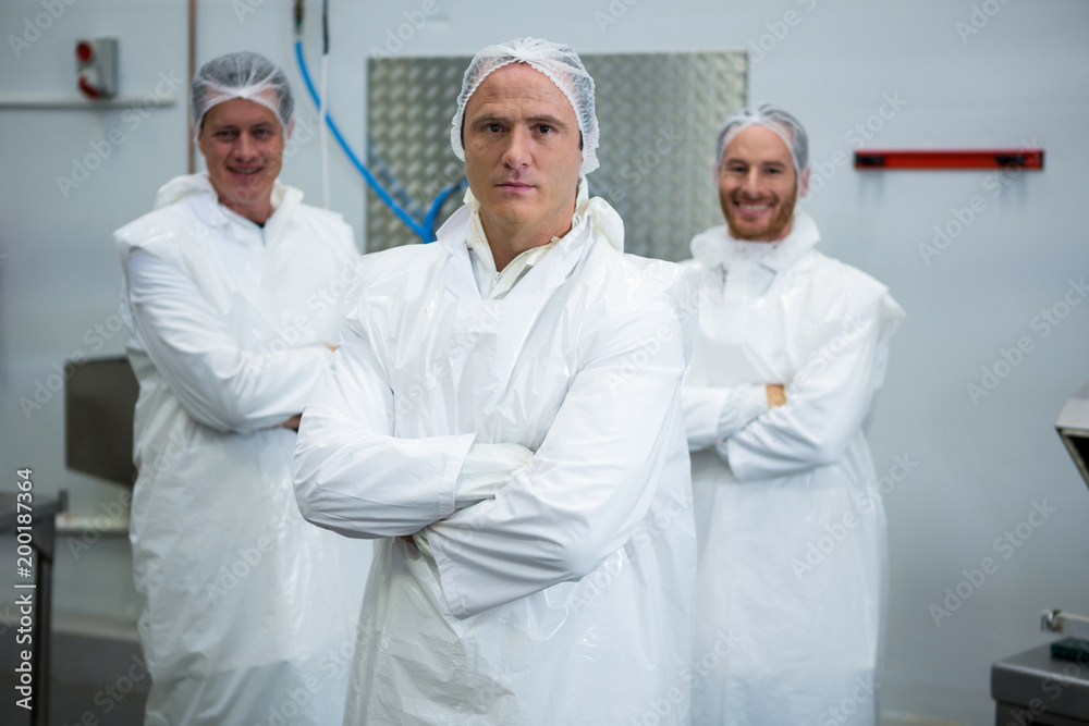 Team of butchers standing with arms crossed Team of butchers standing with arms crossed
