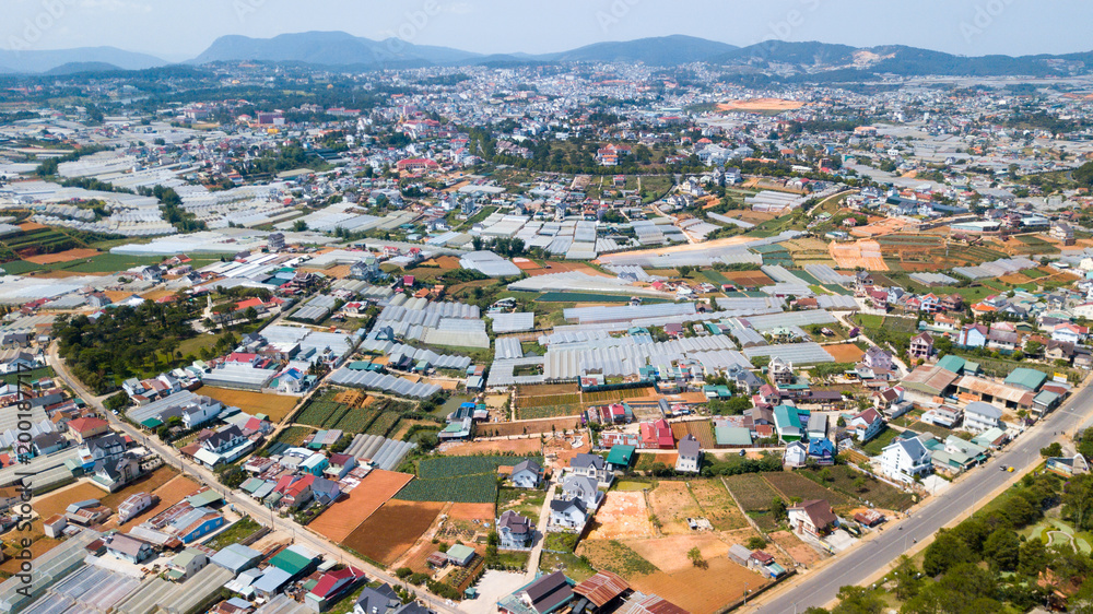 Aerial view e to Dalat city roofs and farms.Located on the Langbian Plateau in the southern parts of the Central Highlands region of Vietnam