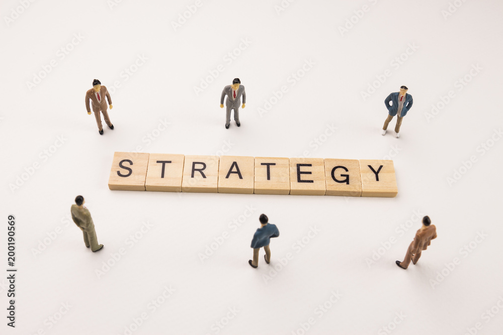 businessman figures meeting on strategy word