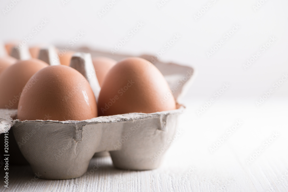 Brown eggs in carton