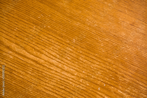Background image of yellow wooden surface with diagonal lines picture. Plywood close up in macro photography.