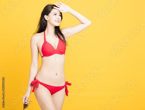 smiling young woman in bikini isolated.