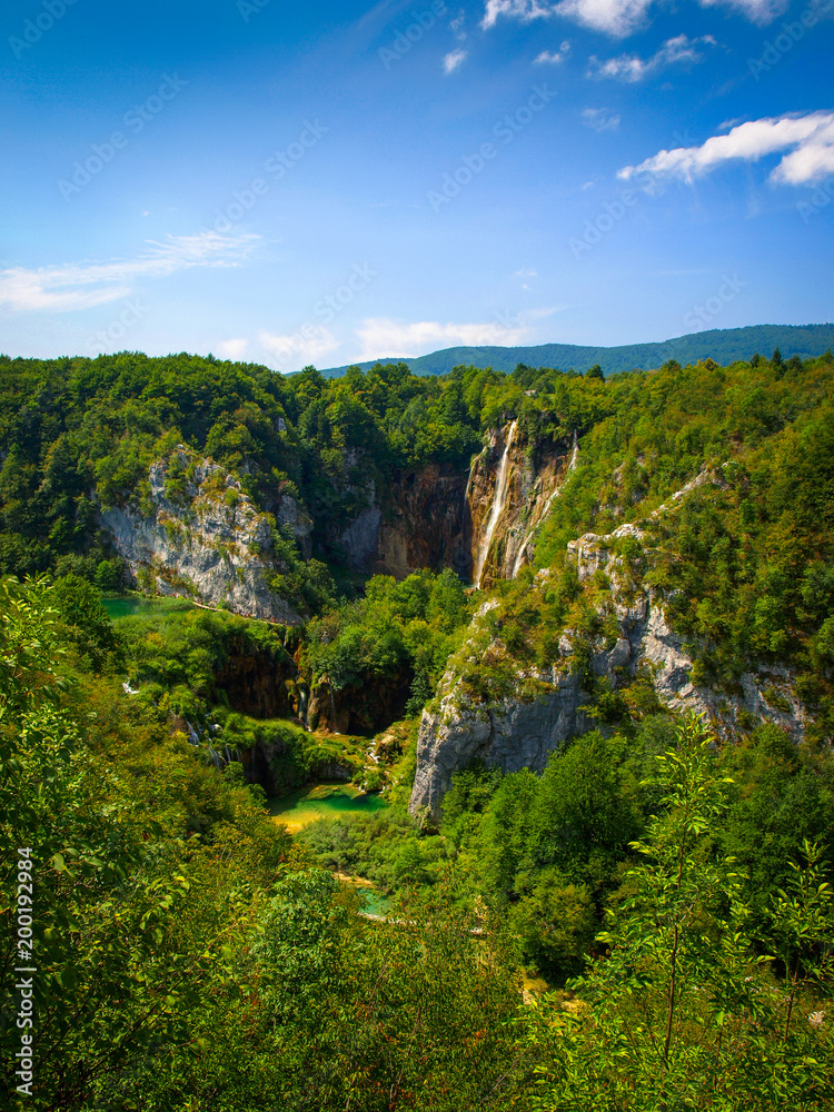 Plitvice National Park landscape with beautiful clear lakes and blue sky