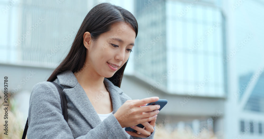 Business woman use of mobile phone