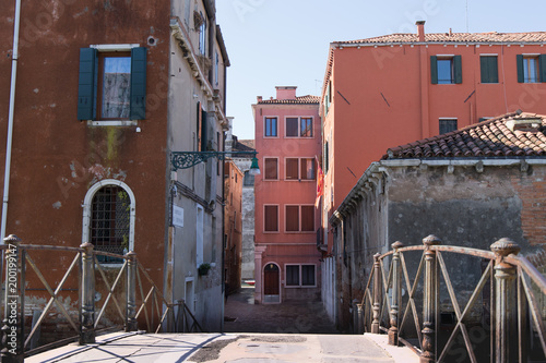 Bridge and exterior of Italian apartment houses with window shutters