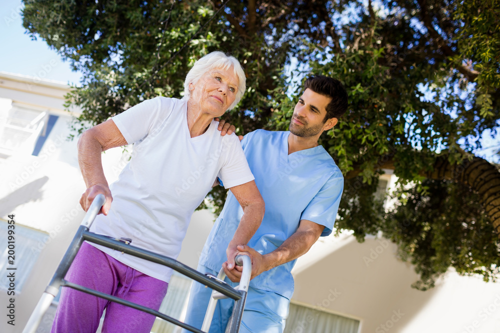 Nurse helping senior woman to walk Nurse helping senior woman to walk