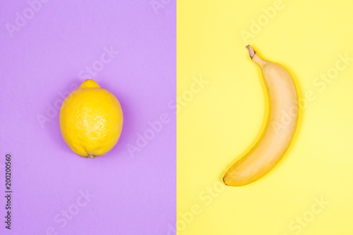 Creative layout of lemon and banana on bright background