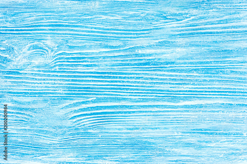 wood background painted in blue and white with scuffs and striped texture
