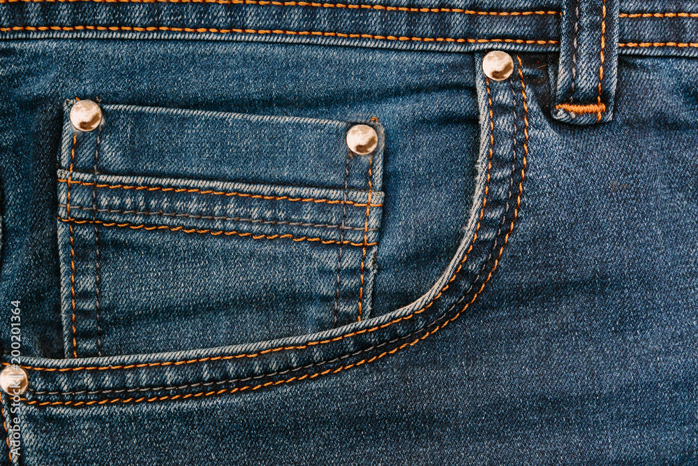 Pocket on blue jeans. Fashion background. Jeans texture Pocket on blue jeans. Fashion background. Jeans texture