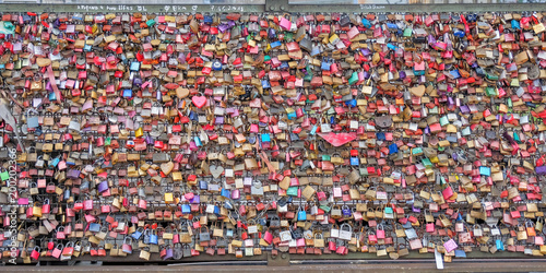 Colorful love padlocks on the Hohenzollern Bridge in Cologne, Germany
