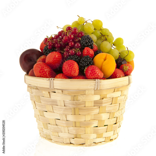 Wicker basket with mixed summer fruit