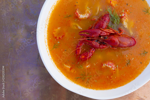 Crayfish soup on a vintage background.