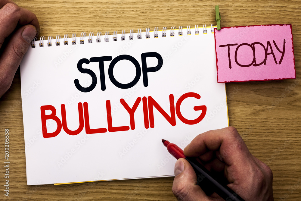 Word writing text Stop Bullying. Business concept for Do not continue Abuse Harassment Aggression Assault Scaring written by Man on Notebook Book Holding Marker on the Wooden background Today. Word writing text Stop Bullying. Business concept for Do not continue Abuse Harassment Aggression Assault Scaring written by Man on Notebook Book Holding Marker on the Wooden background Today.