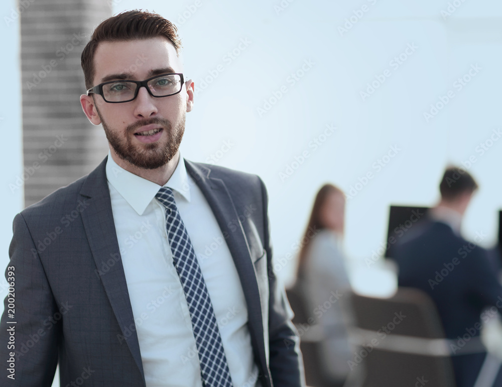 successful businessman on background of office successful businessman on background of office