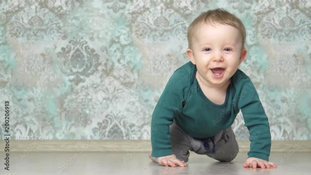 happy smiling baby crawling to the camera happy smiling baby crawling to the camera