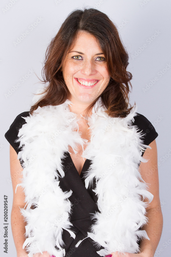 portrait woman standing with feather boa and black dress portrait woman standing with feather boa and black dress