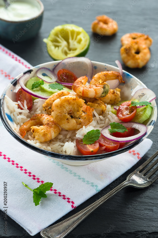 Tandoori prawns with rice and chopped salad - high angle view Tandoori prawns with rice and chopped salad - high angle view