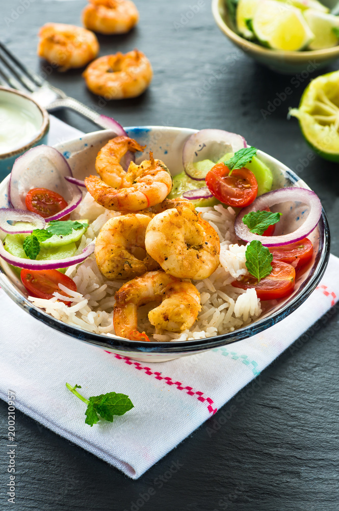 Tandoori prawn skewers with rice and chopped salad - high angle view Tandoori prawn skewers with rice and chopped salad - high angle view