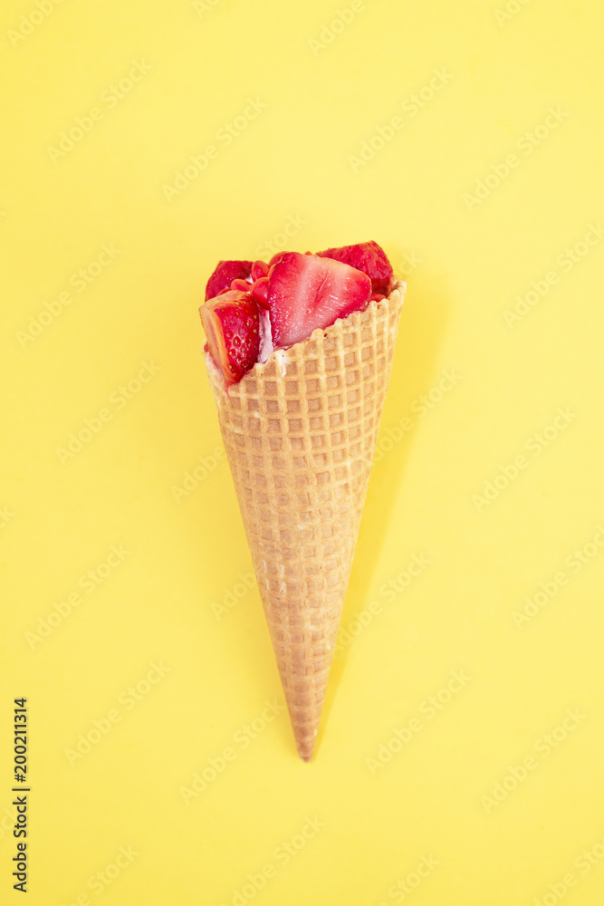 Ice Cream With Pieces Of Red Ripe Strawberry Split In Half In Waffle Cone On Yellow Background The View From The Top Stock Photo Adobe Stock