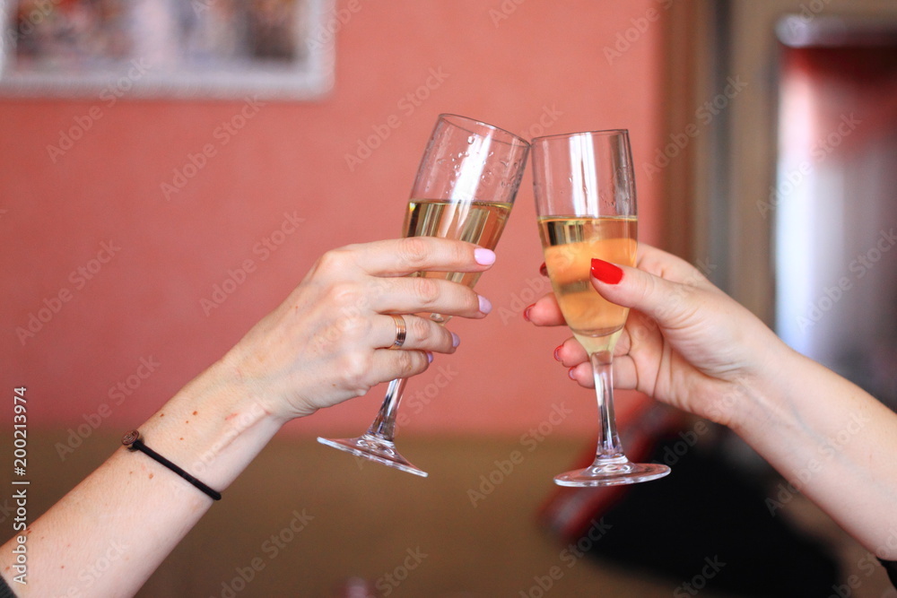 raised glasses of champagne