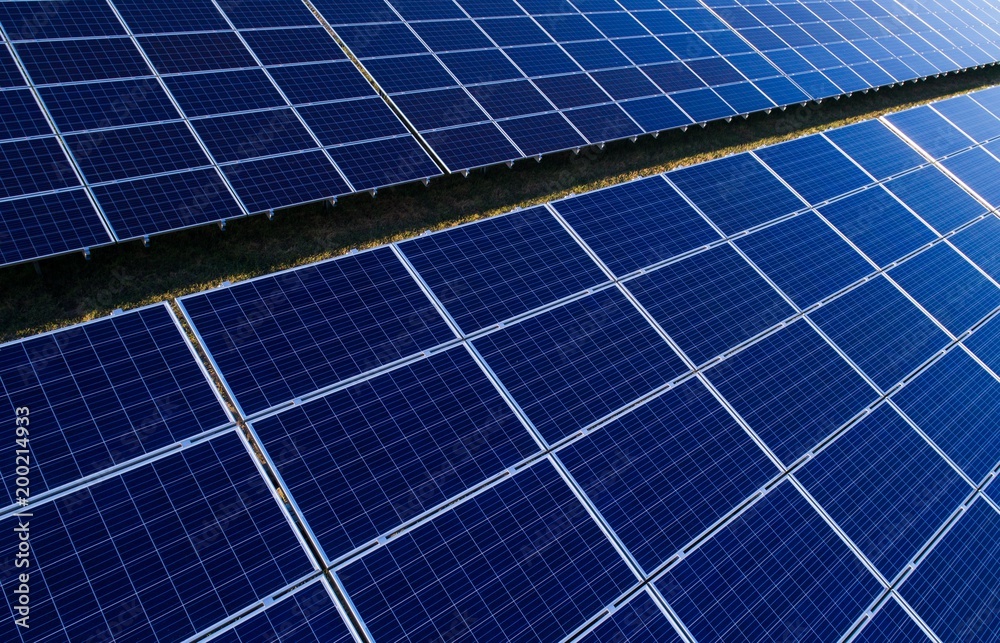 Aerial drone view on photovoltaic panels on solar farm Aerial drone view on photovoltaic panels on solar farm