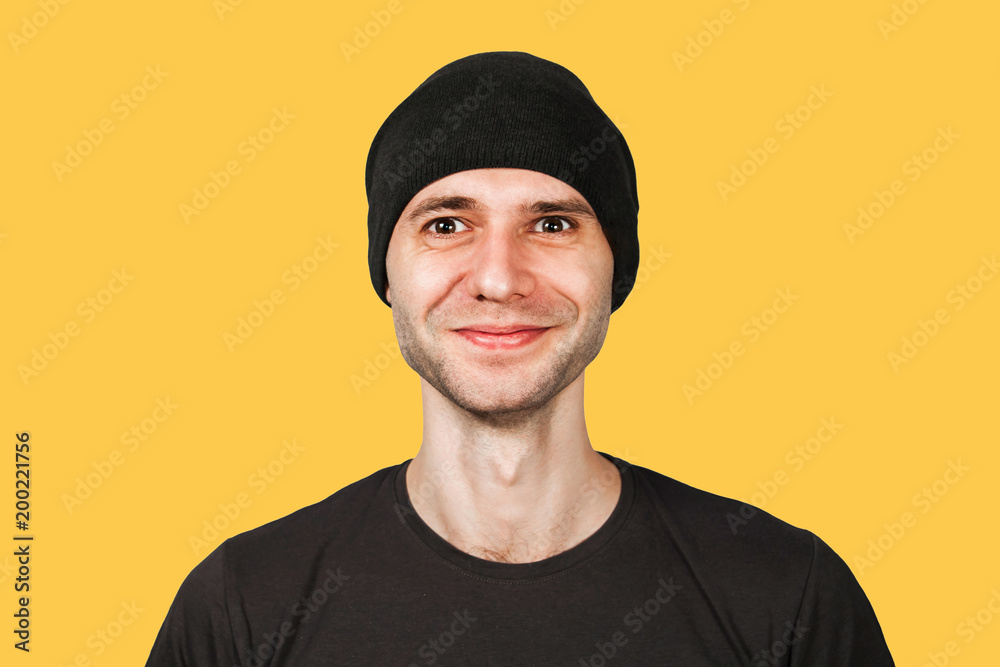 Young funny smiling man in hat isolated on orange. Young funny smiling man in hat isolated on orange.