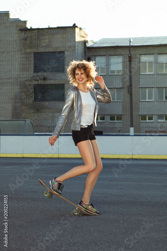 Beautiful young model is posing in casual wear in sport style
