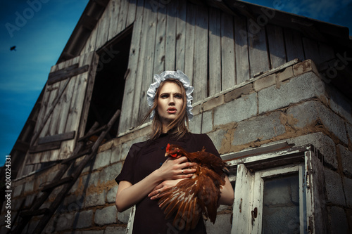 Amish styled model is posing with animals