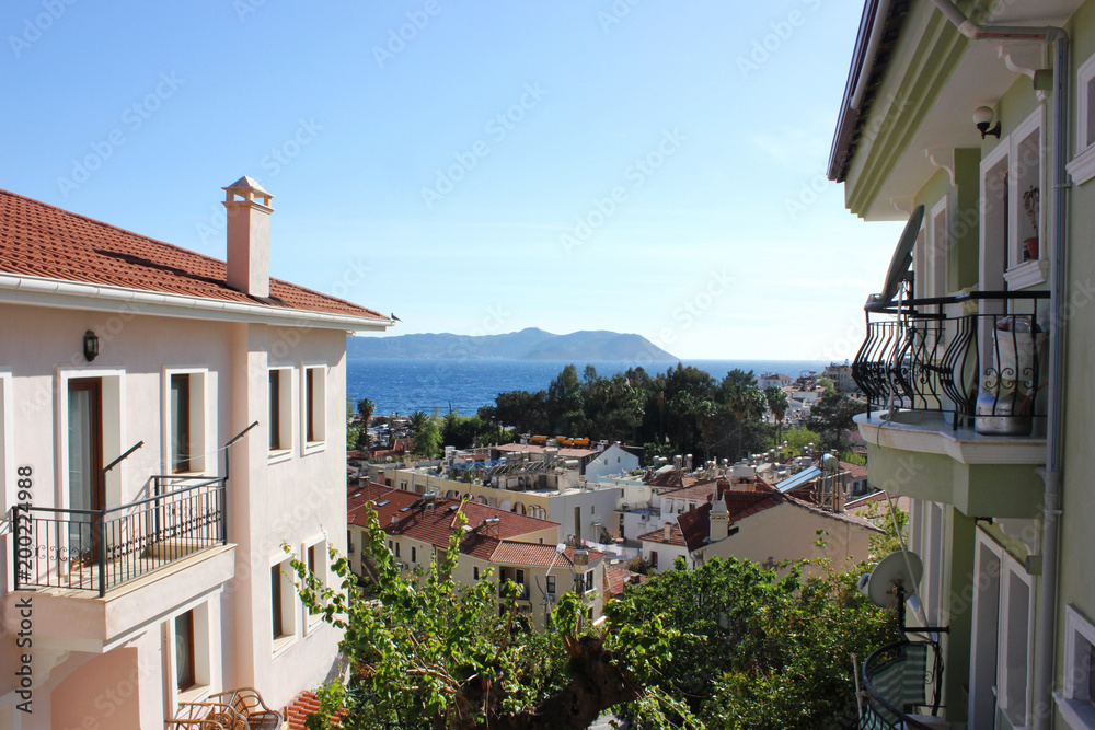 Fototapeta premium Mediterranean town on the beach with red-tiled roofs in Kas, Turkey