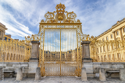 Main golden door in exterior facade of Versailles Palace, Paris, France photo