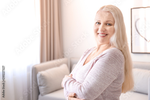 Portrait of female pensioner at home
