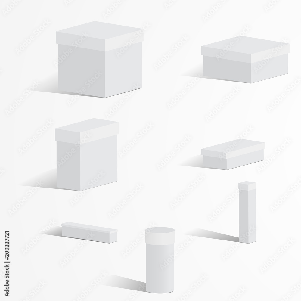 A set of white boxes with lids on a light background A set of white boxes with lids on a light background
