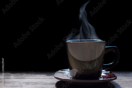 Hot coffee on the wooden table. © 3asy60lf