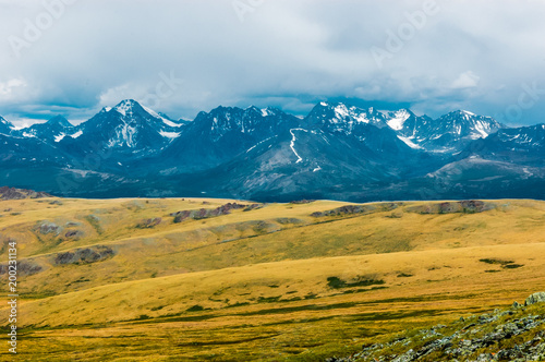 Mountain landscape with clouds. Mountain valley. The Altai mountains. Travel adventure vacation background © antonbelo