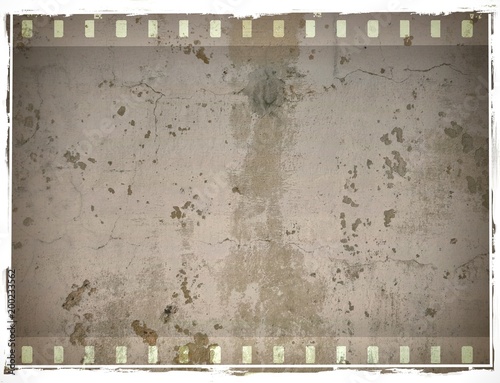 Grunge dripping cracked film strip frame in sepia tones. Wall surface.