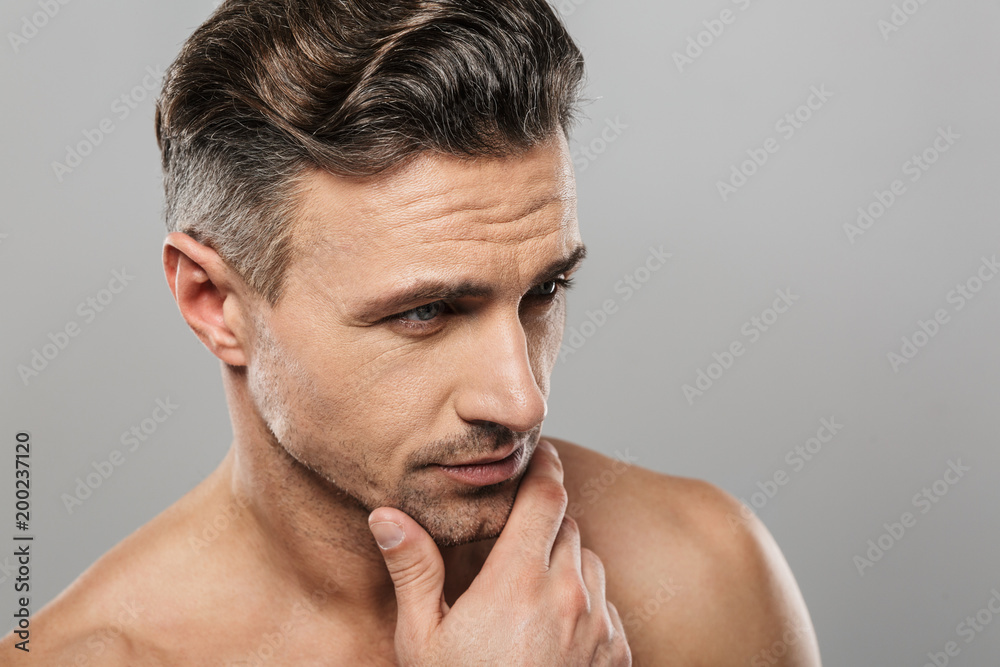 Obraz premium Handsome serious mature man. Looking aside.