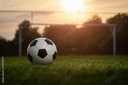 Soccer ball in the sunset