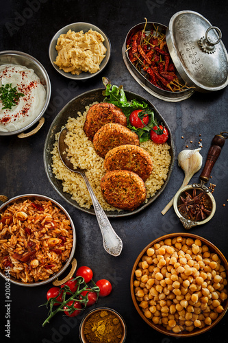 Assorted jewish and arabic levante cuisine prepared food in dishes and pans