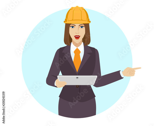 Businesswoman holding a digital tablet PC and pointing something beside of her