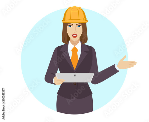 Businesswoman holding a digital tablet PC and showing something beside of her