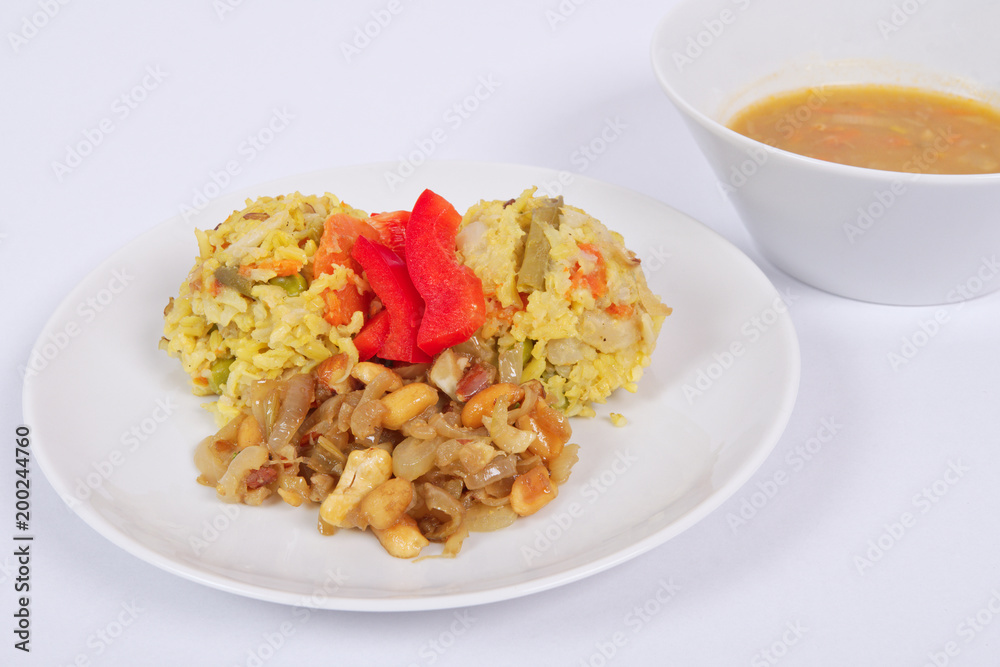 Risotto with vegetables and nuts on a white Risotto with vegetables and nuts on a white