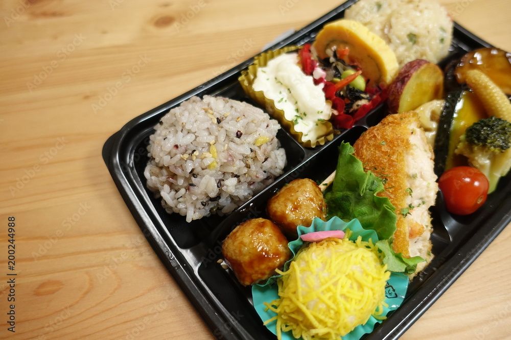 Japanese style obento (rice plate) with varieties of dishes. Japanese style obento (rice plate) with varieties of dishes.