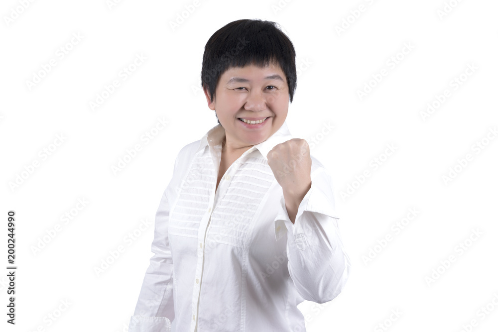 Smiling Asian Middle-aged woman in white shirt raising her fist expressing successful in something isolated on white background Smiling Asian Middle-aged woman in white shirt raising her fist expressing successful in something isolated on white background