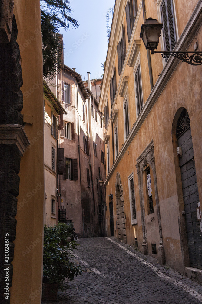 Typical old and narrow street in Rome, Italy