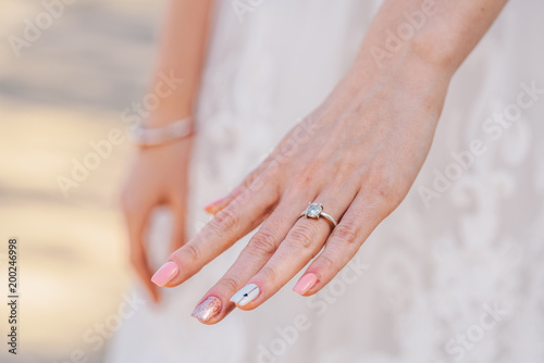 Bride's hand with a engagement ring on it