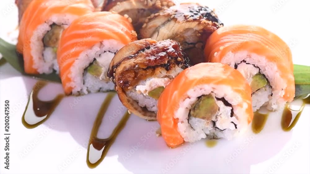 Sushi roll set on white background. Rotated rolls with salmon, tuna